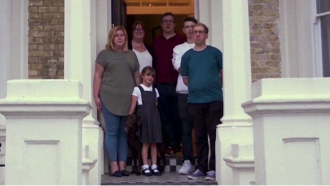 Picture of a large family on a doorstep